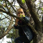 Curious Mum's child looking for a bear from the trees!