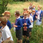 KS1 children under the parachute (bed covers) at the end of the bear hunt!