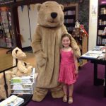 A bear hunter hugs the Walker bear at Waterstones Birmingham