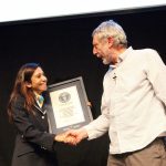 Fortuna from GUINNESS WORLD RECORDS™ hands over the certificate to Michael Rosen